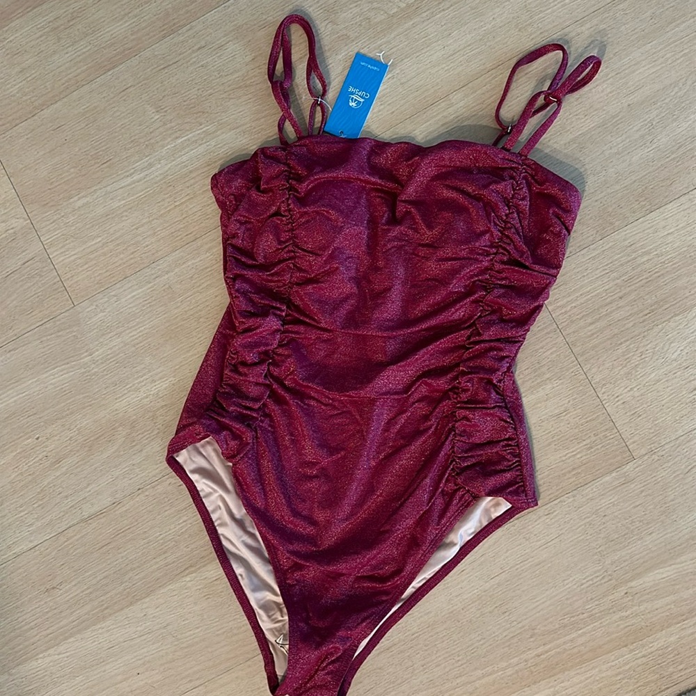 Swimsuit, brand new, never worn. Dark pink with shimmery fabric